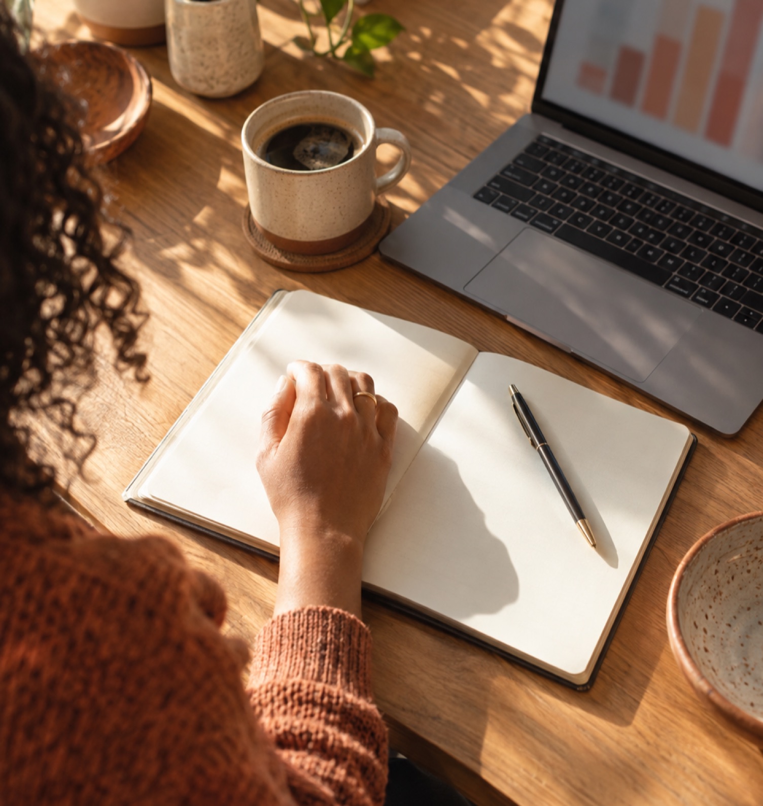 Analyst working through cost figures on a laptop